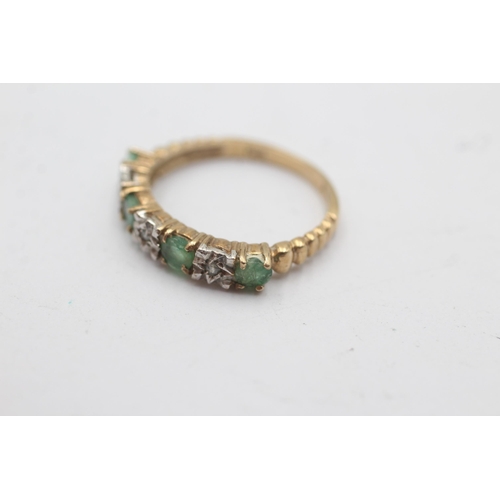 1134 - A 9ct gold diamond and emerald seven stone ring - approx. gross weight 2.1 grams