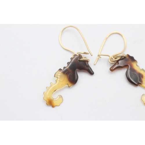 1145 - A pair of 9ct gold amber seahorse drop earrings - approx. gross weight 0.7 grams