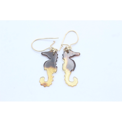 1145 - A pair of 9ct gold amber seahorse drop earrings - approx. gross weight 0.7 grams