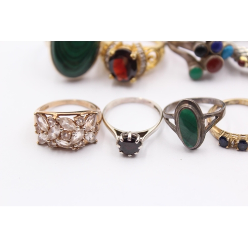 1154 - Twelve .925 silver gemstone set rings