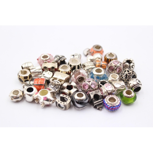 1158 - A large collection of .925 silver branded charms