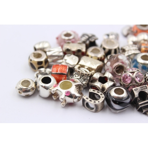 1158 - A large collection of .925 silver branded charms