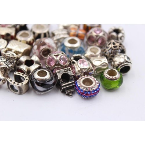 1158 - A large collection of .925 silver branded charms