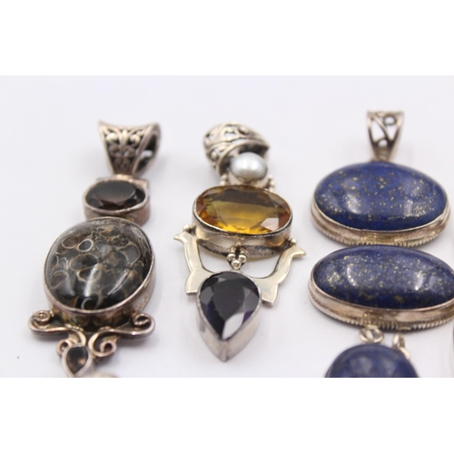 1163 - Eight .925 silver gemstone set pendants