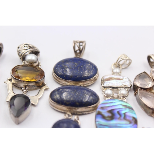 1163 - Eight .925 silver gemstone set pendants