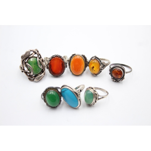 1182 - Eight .925 silver gemstone set rings to include amber etc.