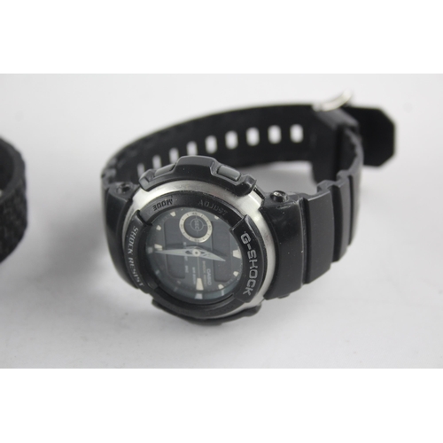 1306 - Four quartz men's wristwatches to include Nixon Robot Rock, G-Shock etc.