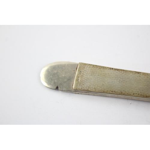 1325 - A stamped .830 silver hammered effect cigar cutter - approx. gross weight 113 grams and 17cm long