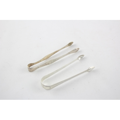 1326 - Two pairs of Georgian hallmarked sterling silver sugar tongs - approx. gross weight 61 grams