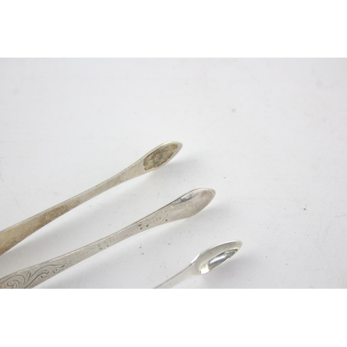 1326 - Two pairs of Georgian hallmarked sterling silver sugar tongs - approx. gross weight 61 grams