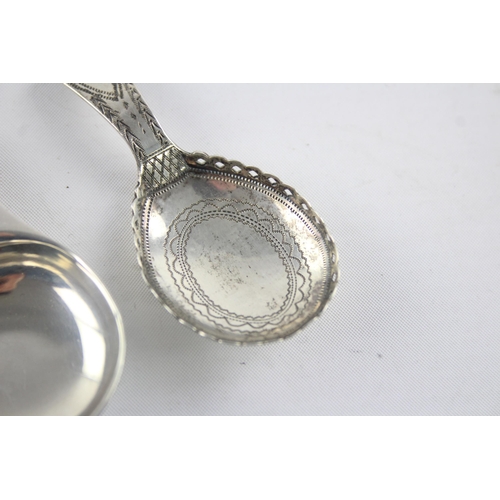 1329 - Two hallmarked sterling silver caddy spoons, one Elizabeth II Coronation and one Georgian - approx. ... 