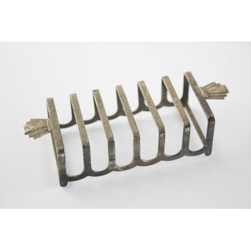 1351 - A Barker Bros Ltd sterling silver seven bar toast rack, hallmarked Birmingham 1960 - approx. gross w... 