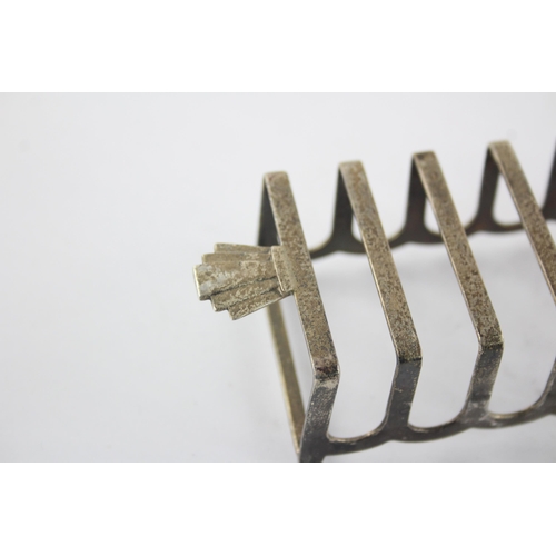 1351 - A Barker Bros Ltd sterling silver seven bar toast rack, hallmarked Birmingham 1960 - approx. gross w... 