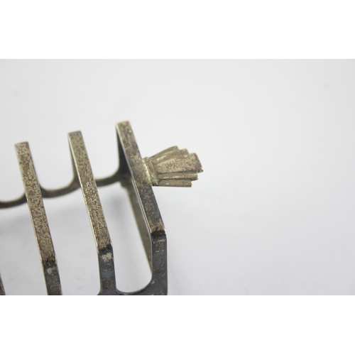 1351 - A Barker Bros Ltd sterling silver seven bar toast rack, hallmarked Birmingham 1960 - approx. gross w... 