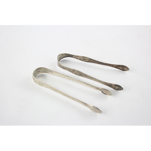 1367 - Two pairs of Georgian hallmarked sterling silver sugar tongs - approx. gross weight 67 grams