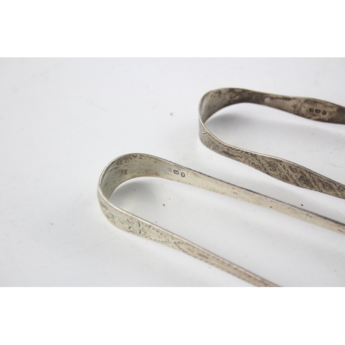 1367 - Two pairs of Georgian hallmarked sterling silver sugar tongs - approx. gross weight 67 grams