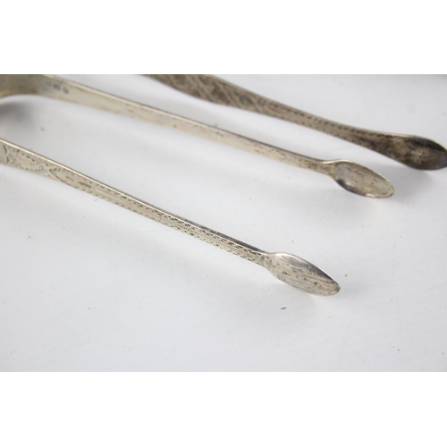 1367 - Two pairs of Georgian hallmarked sterling silver sugar tongs - approx. gross weight 67 grams