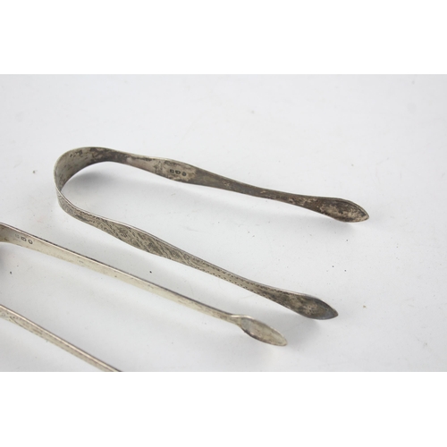 1367 - Two pairs of Georgian hallmarked sterling silver sugar tongs - approx. gross weight 67 grams