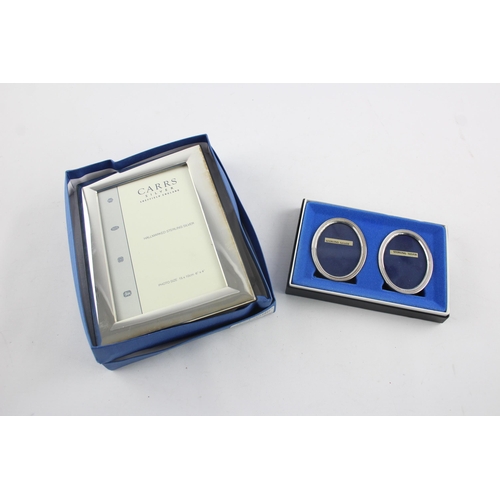 1370 - Two boxed hallmarked sterling silver photo frames - approx. gross weight 333 grams