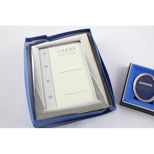 1370 - Two boxed hallmarked sterling silver photo frames - approx. gross weight 333 grams