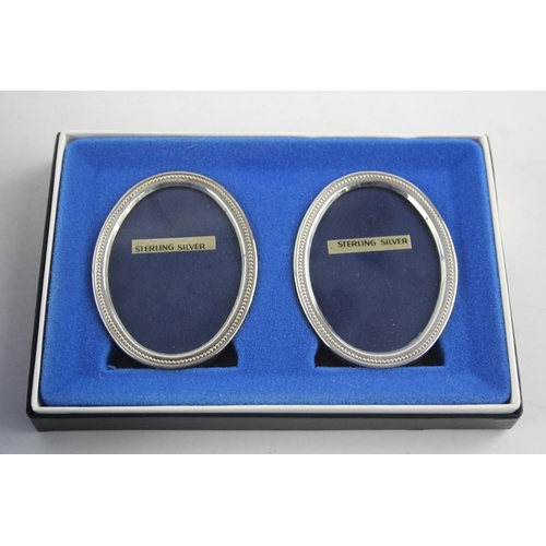 1370 - Two boxed hallmarked sterling silver photo frames - approx. gross weight 333 grams