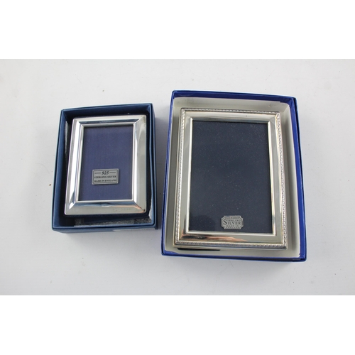 1371 - Two boxed hallmarked sterling silver photo frames - approx. gross weight 378 grams