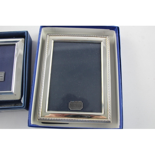 1371 - Two boxed hallmarked sterling silver photo frames - approx. gross weight 378 grams