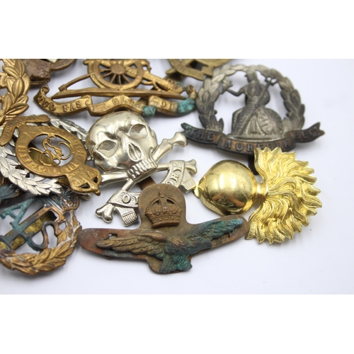 1381 - A collection of military cap badges to include Scottish, K.O.Y.L.I, R.A.F, SAS etc.