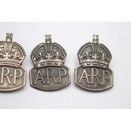 1384 - Five WWII A.R.P sterling silver badges - approx. gross weight 44 grams