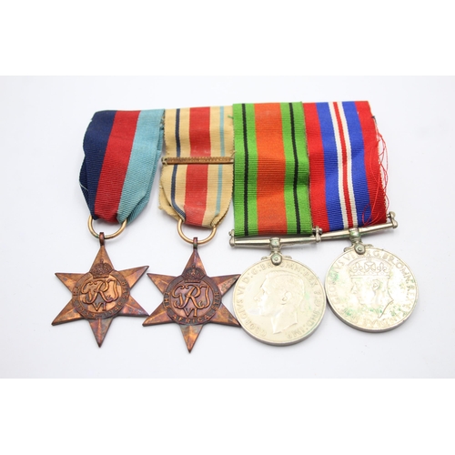 1385 - A WWII mounted medal group to include Africa Star with North Africa clasp etc.