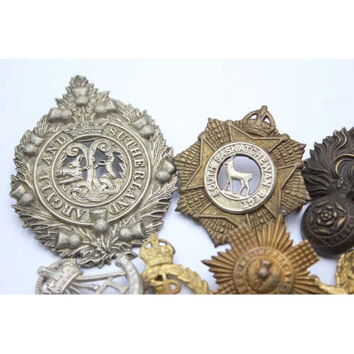 1396 - Ten military cap badges to include R.F.C, Canadian, Irish etc.