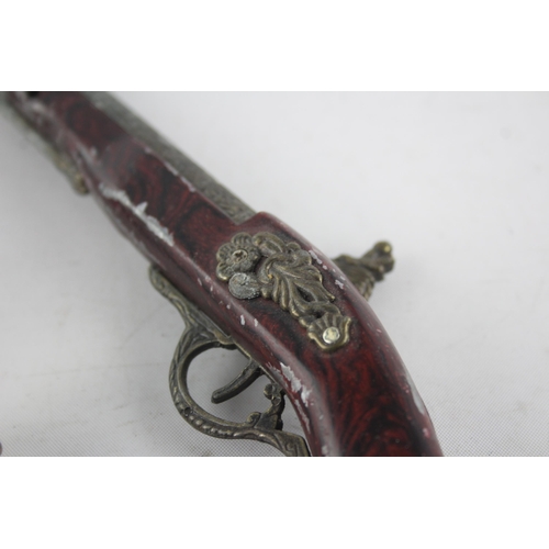 1409 - Three vintage novelty gun shaped cigarette/table lighters