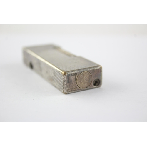 1412 - A Dunhill Rollagas silver plated cigarette lighter