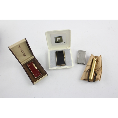 1421 - Four vintage cigarette lighters, two Pierre Cardin, one Guy Laroche and one Louis Feraud