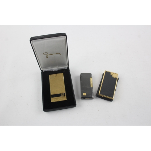 1423 - Three vintage Givenchy cigarette lighters