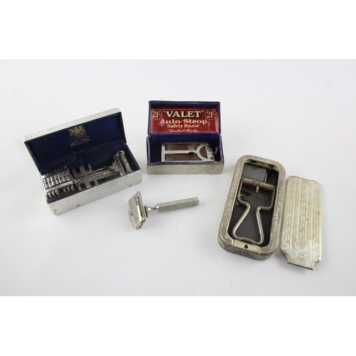 1428 - Four vintage gent's grooming razors and blades to include Gillette etc.