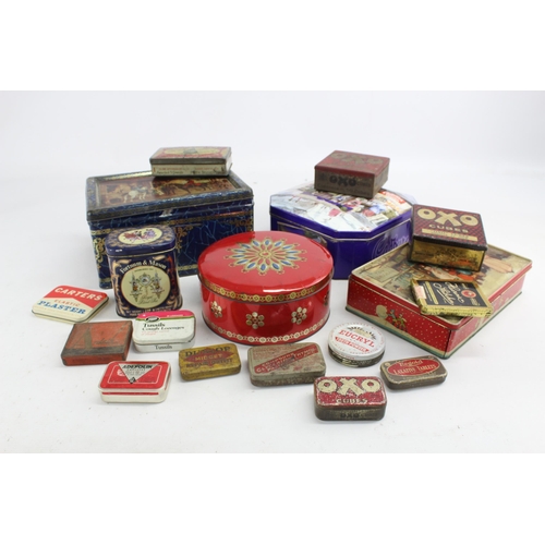 694 - A collection of vintage tins to include Cadbury's, OXO etc.