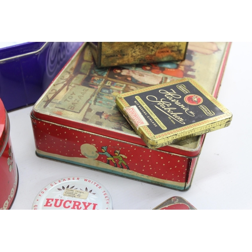 694 - A collection of vintage tins to include Cadbury's, OXO etc.