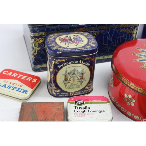 694 - A collection of vintage tins to include Cadbury's, OXO etc.