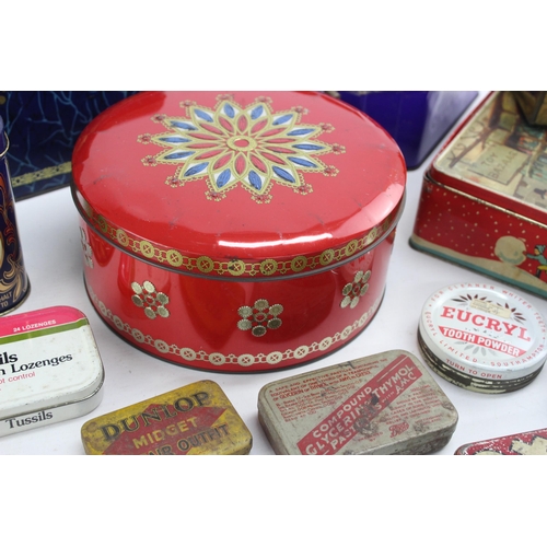 694 - A collection of vintage tins to include Cadbury's, OXO etc.