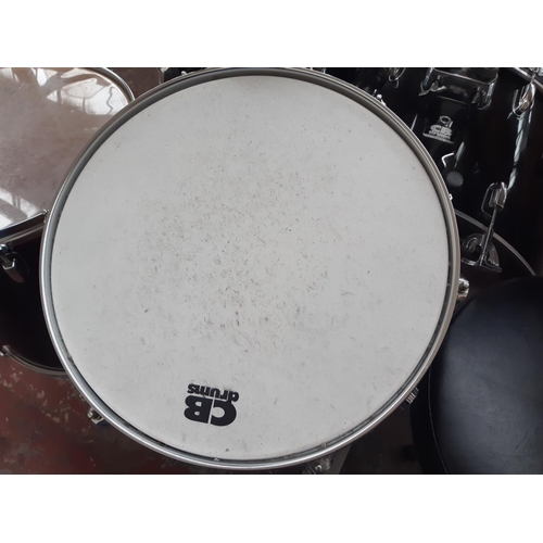 822A - A black CB Drums five piece drum kit comprising bass drum, floor tom, two rack toms, snare on stand,... 