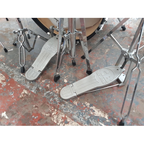 822A - A black CB Drums five piece drum kit comprising bass drum, floor tom, two rack toms, snare on stand,... 