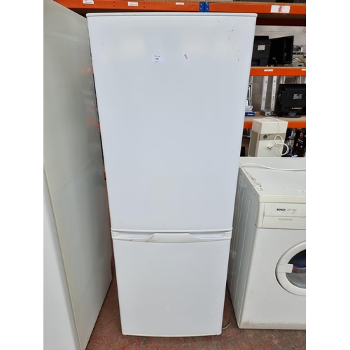 959 - An upright fridge freezer - approx. 149cm high