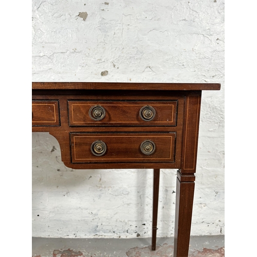 10 - An Edwardian inlaid mahogany writing table with five drawers and tapering supports - approx. 74cm hi... 