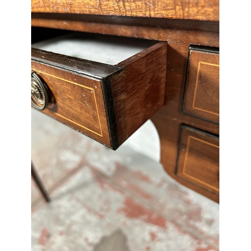 10 - An Edwardian inlaid mahogany writing table with five drawers and tapering supports - approx. 74cm hi... 