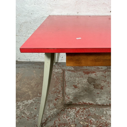 13 - A mid 20th century Ernest Race style red laminate and cast metal office desk with three drawers - ap... 