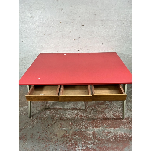 13 - A mid 20th century Ernest Race style red laminate and cast metal office desk with three drawers - ap... 