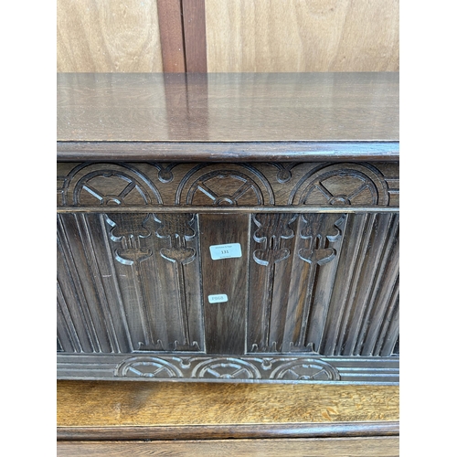 131 - A Strongbow Furniture carved oak blanket box