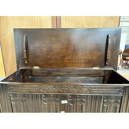 131 - A Strongbow Furniture carved oak blanket box