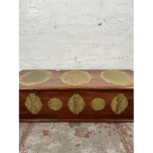 14 - An Indian sheesham wood blanket box with brass detailing